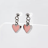 Pair of heart-shaped earrings with pink hearts and silver metal on a white background