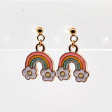 Rainbow and flower earrings on a white background