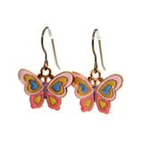 Butterfly-shaped earrings on a white background