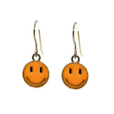 Orange smiley face earrings on a white background