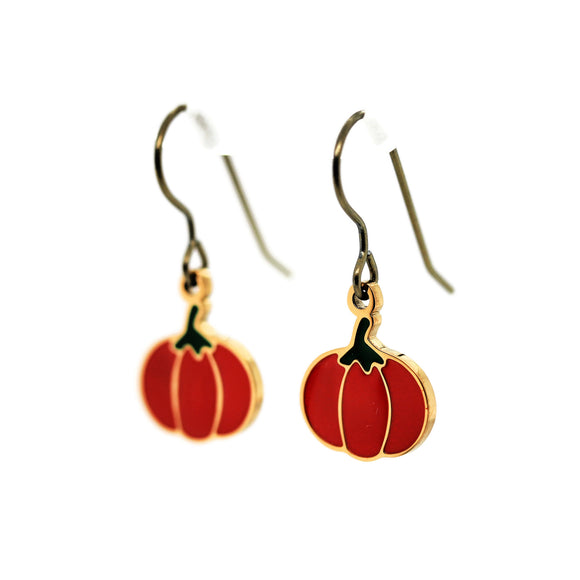 Pumpkin-shaped earrings on a white background