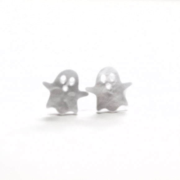 Silver ghost-shaped earrings on a white background