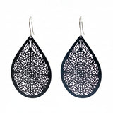 Teardrop-shaped earrings with intricate patterns on a white background