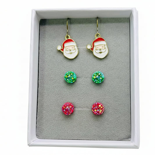Set of Christmas-themed earrings including Santa face and colorful round designs in a box.
