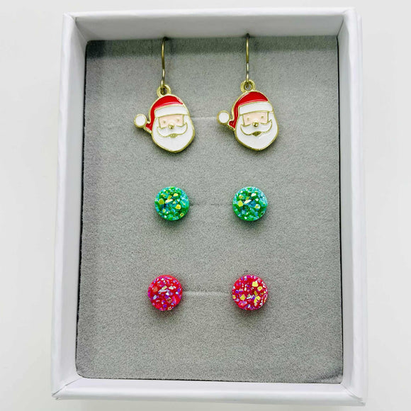 Set of Christmas-themed earrings including Santa face and colorful round designs in a box.