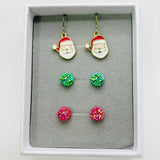 Set of Christmas-themed earrings including Santa face and colorful round designs in a box.