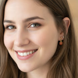 model wearing our ladybug earrings on invisible clip on backs