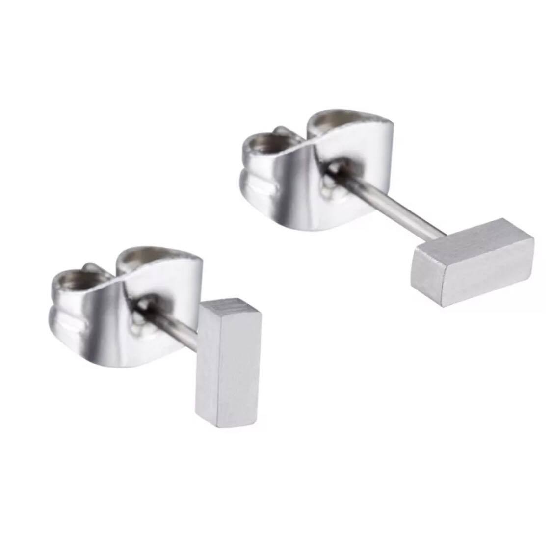 A pair of silver titanium bar stud earrings with butterfly back closures.