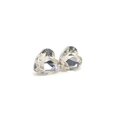 A pair of heart-shaped rhinestone stud earrings with clear stones set in silver-colored settings.