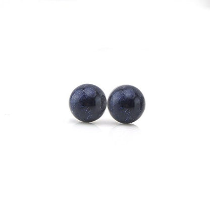 A pair of blue goldstone stud earrings with a dome-shaped, dark midnight blue appearance, set against a white background.