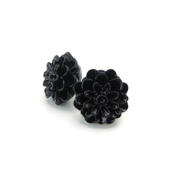 A pair of black dahlia floral earrings made of resin, displayed against a white background with a text overlay suggesting more colors available.