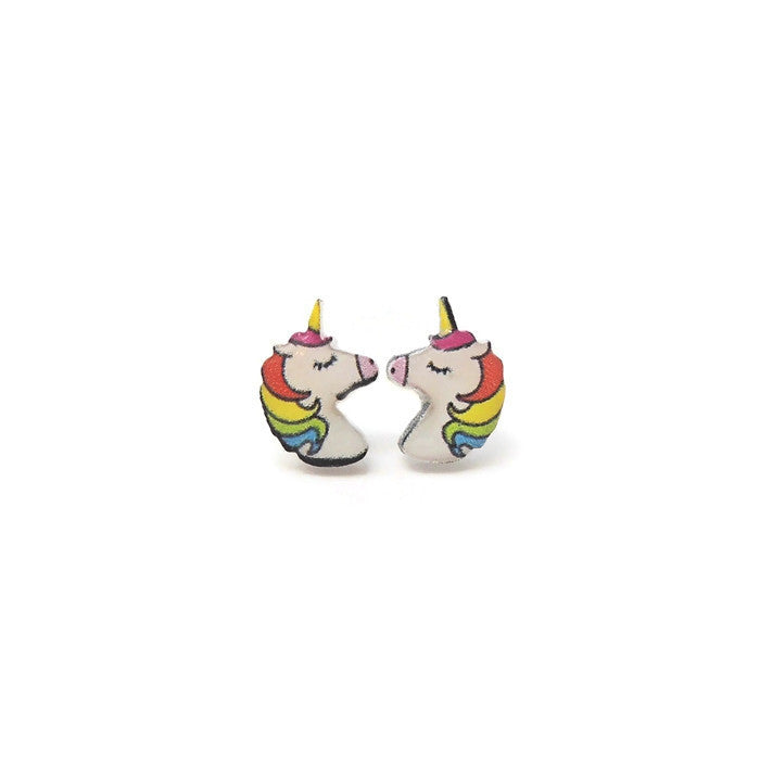 A pair of rainbow-colored unicorn stud earrings with white and multicolored accents, displayed against a plain background.