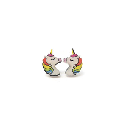 A pair of rainbow-colored unicorn stud earrings with white and multicolored accents, displayed against a plain background.