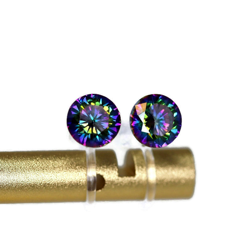 A pair of multi-color cubic zirconia earrings displayed on a gold-colored post, showcasing their vibrant rainbow-like color.