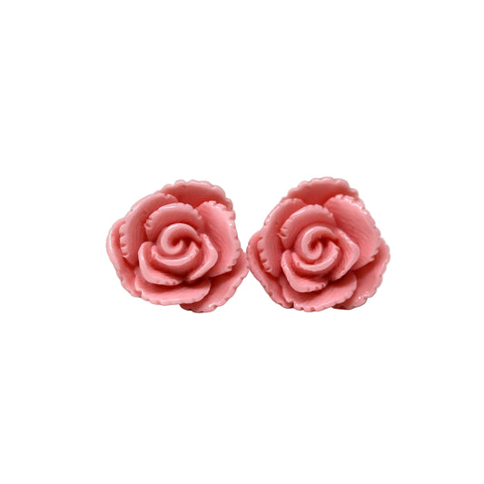 A pair of pink vintage-style rose stud earrings made of resin, displayed against a white background.