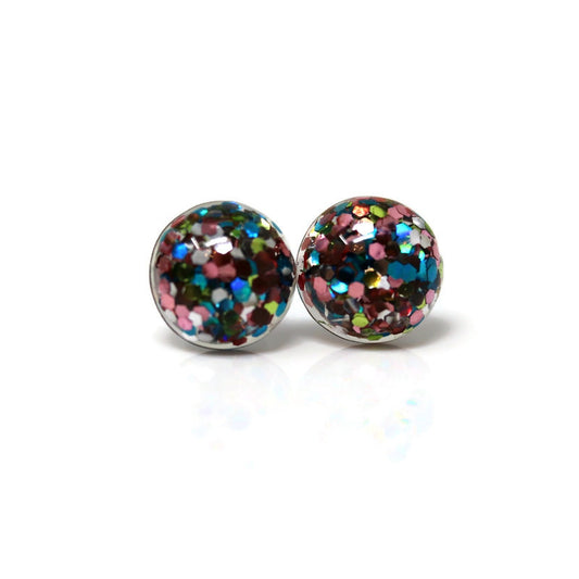 A pair of dome-shaped resin stud earrings filled with multicolored glitter, presented against a white background.