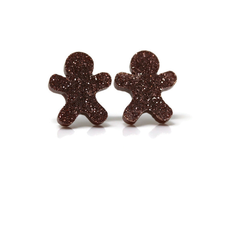 A pair of brown glitter acrylic gingerbread cookie shaped stud earrings.
