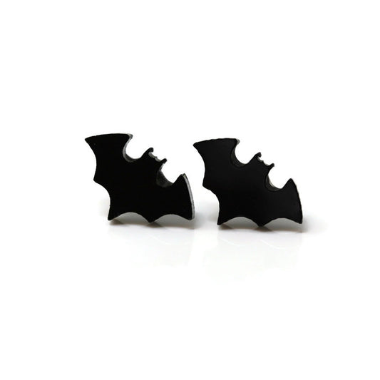 A pair of black bat-shaped stud earrings on a white background.
