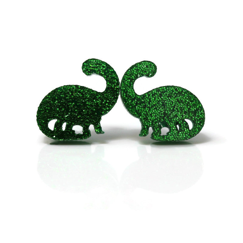 A pair of green glitter acrylic brontosaurus dinosaur stud earrings.