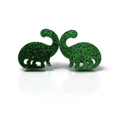 A pair of green glitter acrylic brontosaurus dinosaur stud earrings.