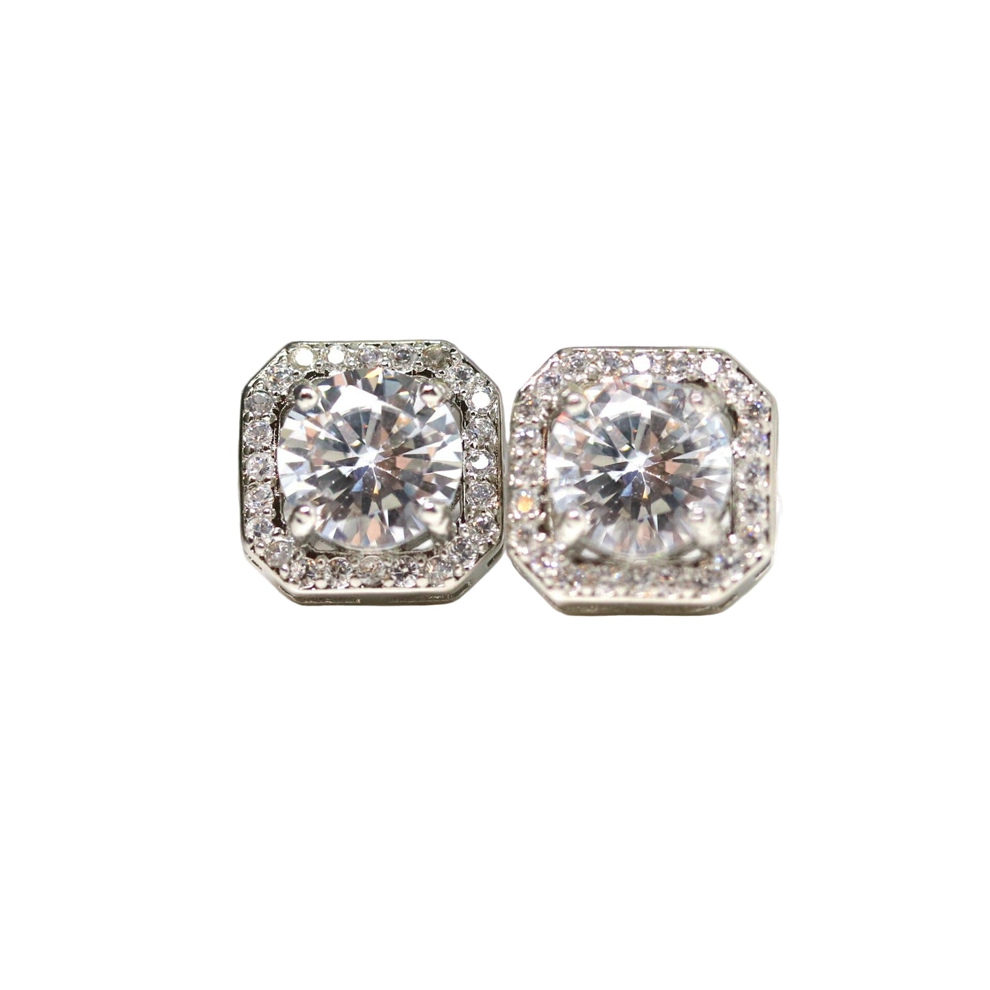 A pair of silver-tone invisible clip-on earrings with a rhombus rhinestone halo design, featuring a clear glass round rhinestone in the center surrounded by smaller rhinestones.