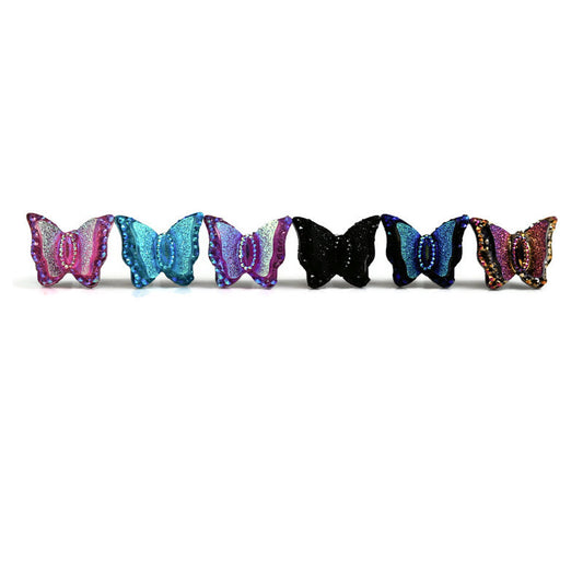 A collection of butterfly-shaped stud earrings in various colors, arranged in a row.