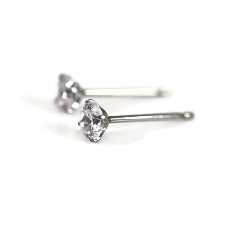 A pair of titanium martini set cubic zirconia stud earrings.