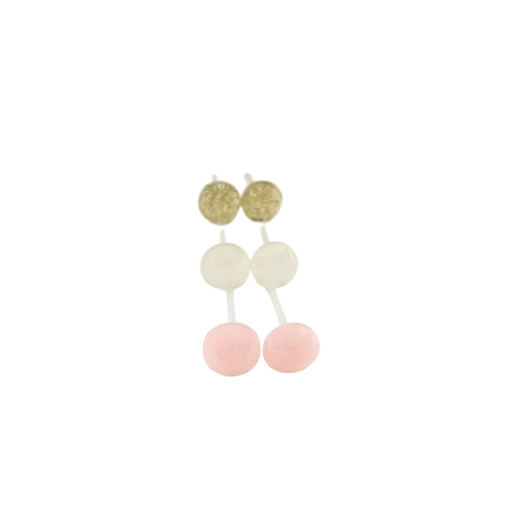A collection of tiny faceted stud earrings in gold, clear, and pink colors displayed on a white surface with a floral pattern in the background. The earrings are presented with text indicating 'More Colors' available.