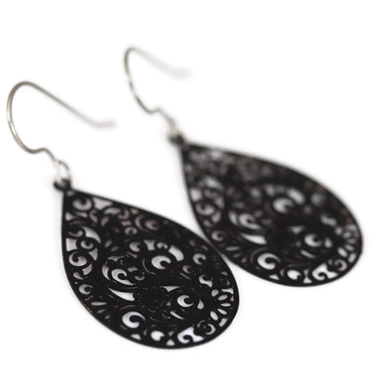 A pair of black filigree teardrop dangle earrings with a plastic hook for metal-sensitive ears.
