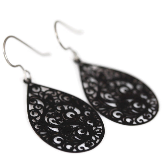 A pair of black filigree teardrop dangle earrings with a plastic hook for metal-sensitive ears.