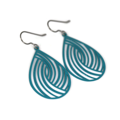 A pair of teardrop dangle earrings with a swirl pattern, in a dark teal color.