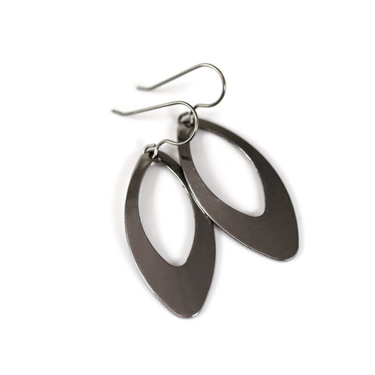 A pair of polished stainless steel open long oval dangle earrings with a post-style hook.