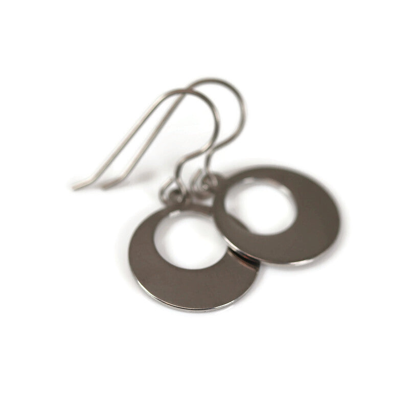 A pair of polished stainless steel dangle earrings with open circles as the design, featuring a plastic hook for pierced ears.