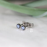 Titanium stud earrings, bezel set crystals, sky blue