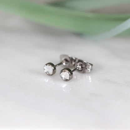 Titanium stud earrings, bezel set crystals, clear