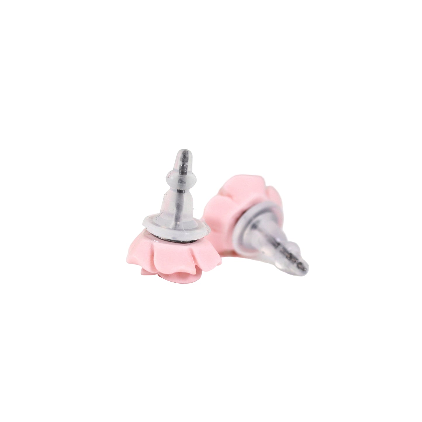 A pair of pink silicone earring backs designed to fit titanium posts, displayed against a floral background.