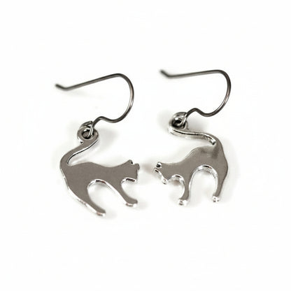 A pair of silver stainless steel cat dangle earrings with a plastic hook.