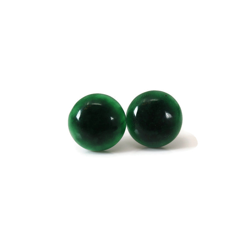 A pair of round simulated jade stone earrings displayed against a white background.
