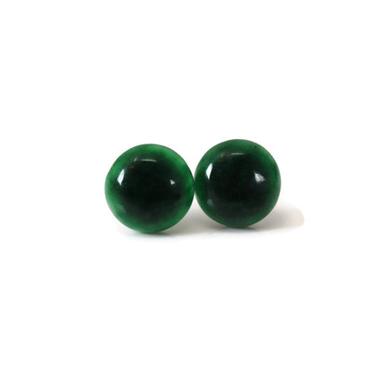 A pair of round simulated jade stone earrings displayed against a white background.