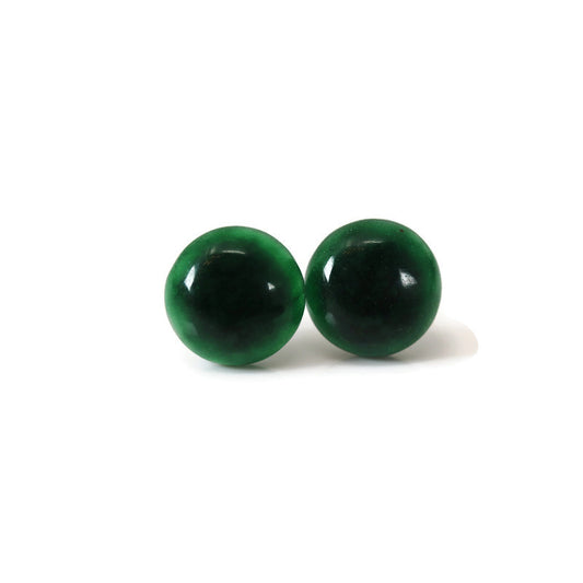 A pair of round simulated jade stone earrings displayed against a white background.