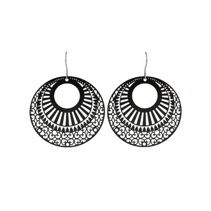 A pair of laser cut filigree dangle earrings in black color with a circular design a