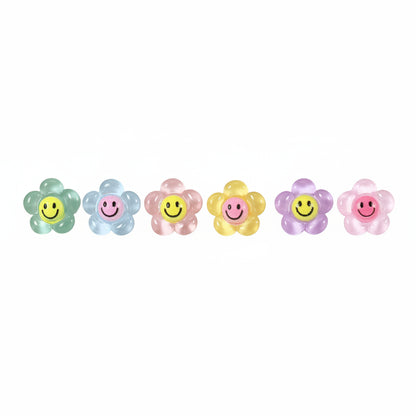 A row of smiley face flower earrings