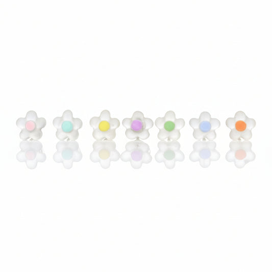 A collection of dainty dot flower stud earrings in various colors, set against a neutral background.