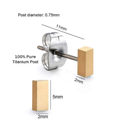 A pair of gold  titanium bar stud earrings with butterfly back closures.