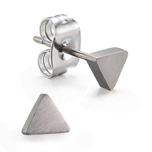 A pair of silver-colored titanium triangle stud earrings, showing the back butterfly clasp and the front rubber nut.