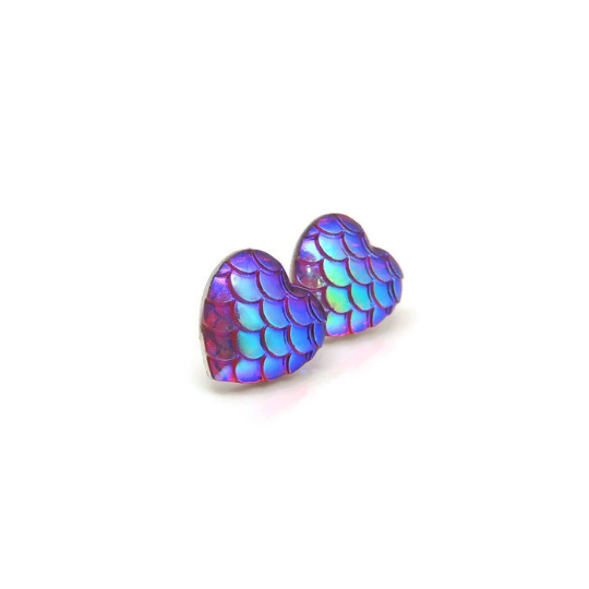 A pair of multicolored heart-shaped mermaid scale stud earrings made of resin.