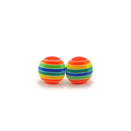 A pair of rainbow striped stud earrings with visible multicolored stripes on a white background.