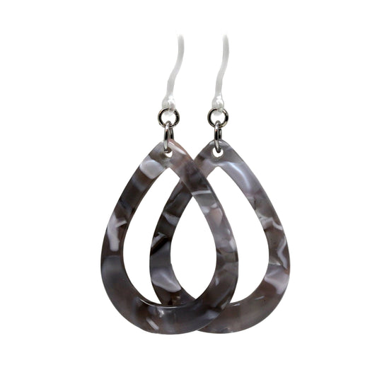 A pair of acrylic teardrop dangle earrings with a tortoiseshell pattern in shades of clear, royal blue, and grey.