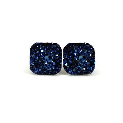 A pair of blue square druzy stud earrings with rounded corners on a white background, with a text overlay saying 'More Colors'.