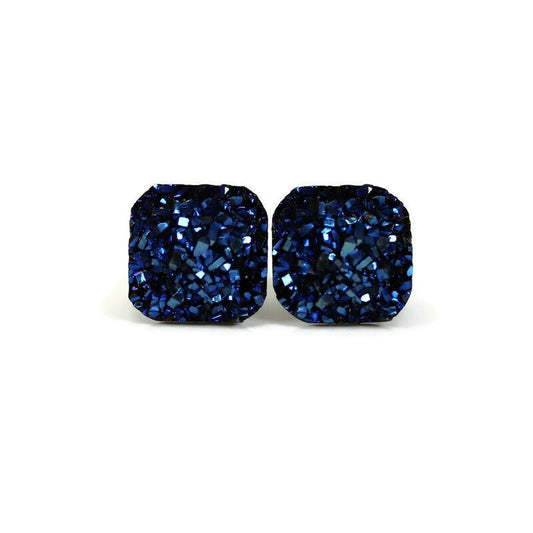 A pair of blue square druzy stud earrings with rounded corners on a white background, with a text overlay saying 'More Colors'.